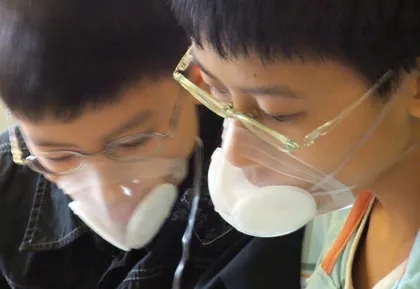 Children wearing Totobobo mask