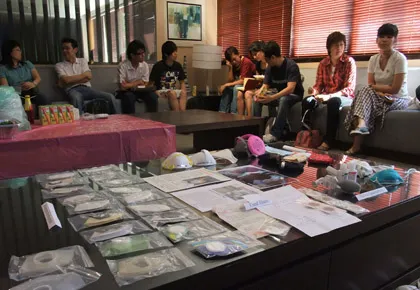 D&T teachers sitting behind the early hand made prototypes and benchmark masks
