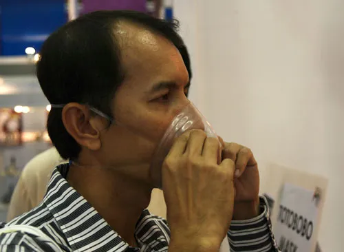 visitor trying Totobobo mask visitor trying Totobobo mask