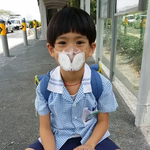 Happy Lucas wearing a well fitted Totobobo mask